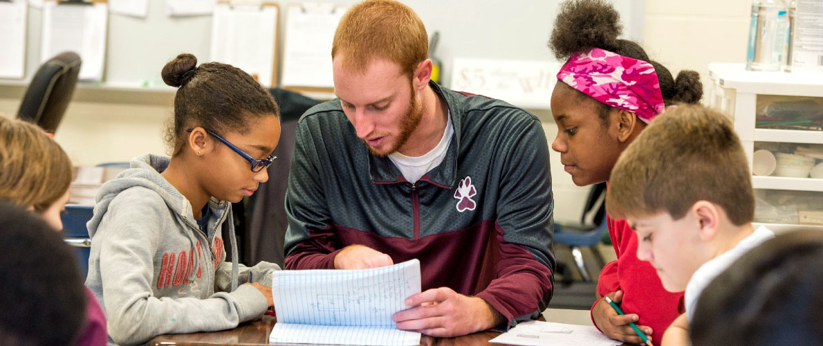 SIU student teacher working with students