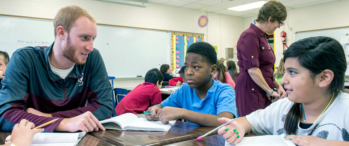 Student teacher with students