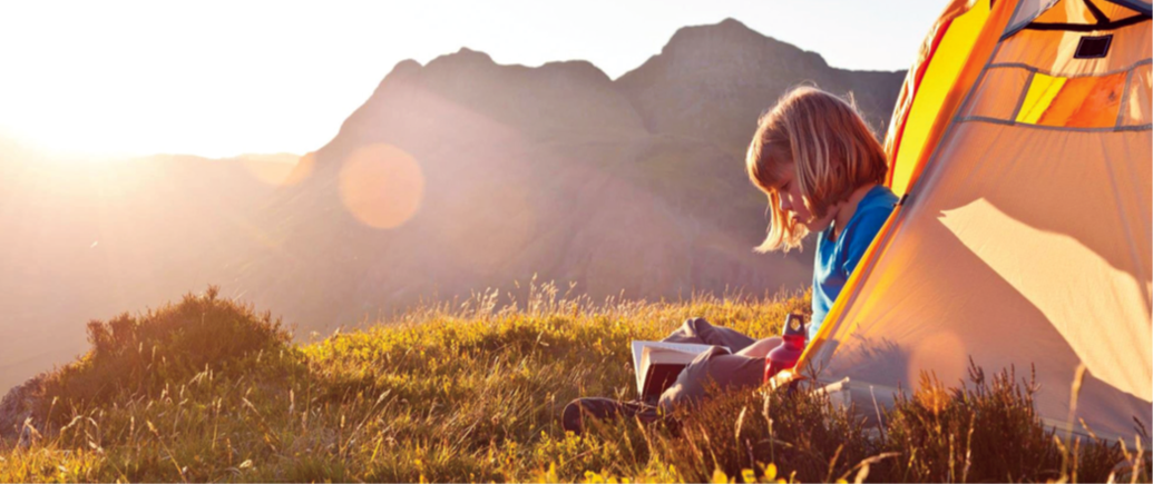 child reading outside