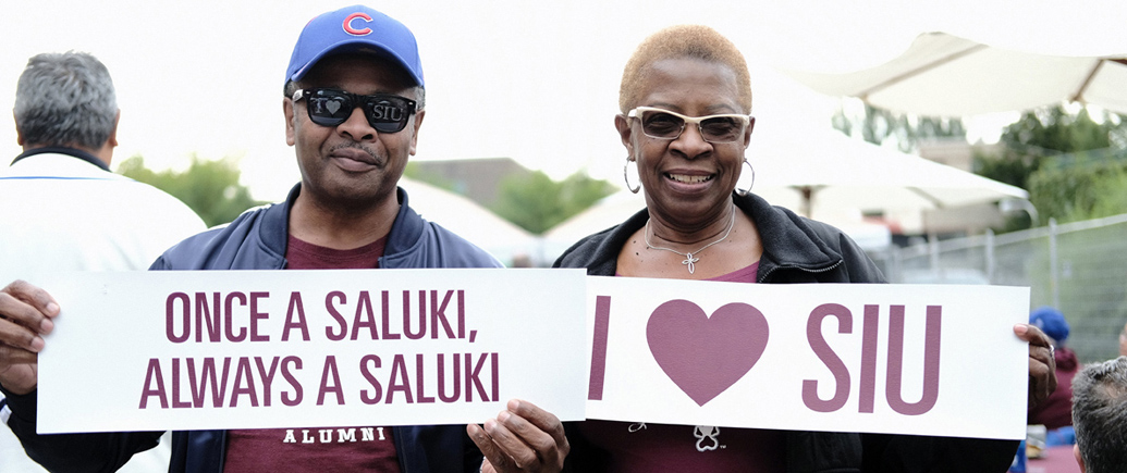 SIU alumni holding signs