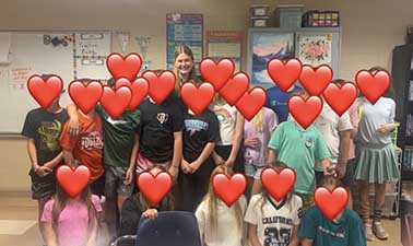 Emma Rogers, Student Spotlight, pictured with a group of her students.